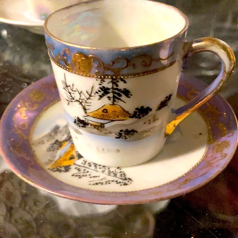 Miniature teacup with hand painted scene